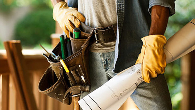 McGuire Contracting crew member with tool belt